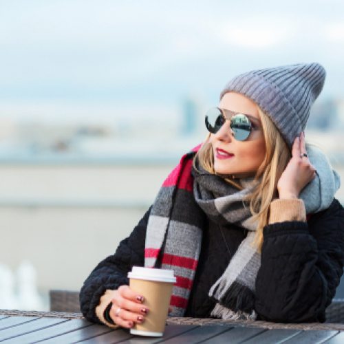 Woman with sunglasses and coffee
